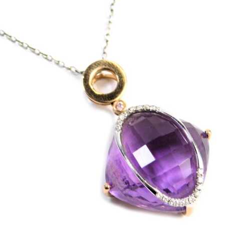 An 18ct gold amethyst and diamond pendant, on a silver chain.