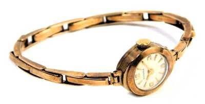 A Rodonia 9ct gold lady's wristwatch, circular silvered dial, on a 9ct gold bracelet, 10.6g all in.