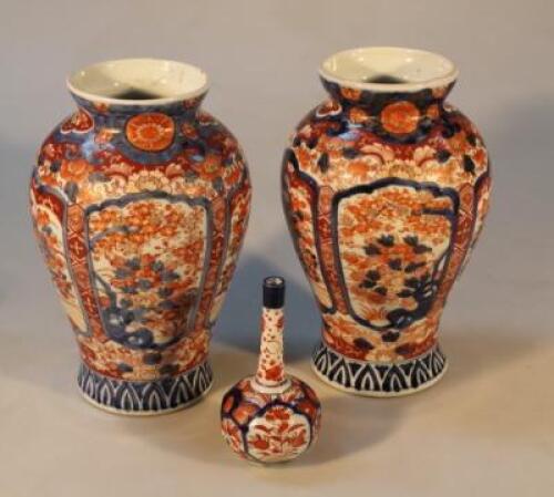 A pair of 19thC Japanese Imari baluster vases