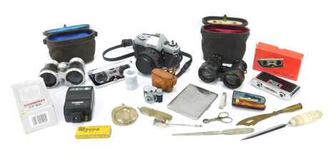 Cameras and binoculars, including a Minolta X300 camera, two sets of field glasses, one with hand written inscription Le Fit Paris, micro midget camera, an amber and 9ct gold rimmed cheroot holder, silver plated cigarette case, agate handled letter opener