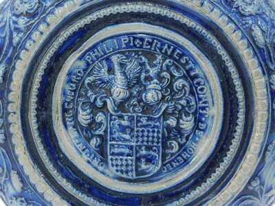 A Westerwald salt glazed jug, on a blue and grey patterned ground, with shield, 29cm high. - 4