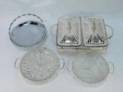 A group of silver plated table wares, comprising a two piece breakfast server, with glass inserts and silver plated rim, 11cm high, 30cm wide, two glass and silver rimmed serving dishes, 21cm wide, and a silver plated and berry design with swing handle, 2 - 2