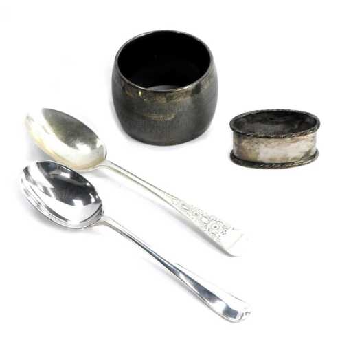 A George V napkin ring, Birmingham 1930, further napkin ring, bearing indistinct marks, and two silver teaspoons, 2.86oz. (4)