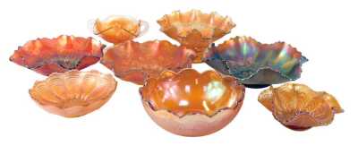 A group of carnival glass, to include orange glass pedestal dish, 21cm diameter, two handled dish, 16cm wide, etc.