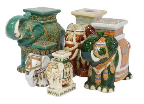 Five ceramic elephant stools, of varying sizes and glazes, comprising three large 43cm high, medium 27cm high, small 26cm high. (5)