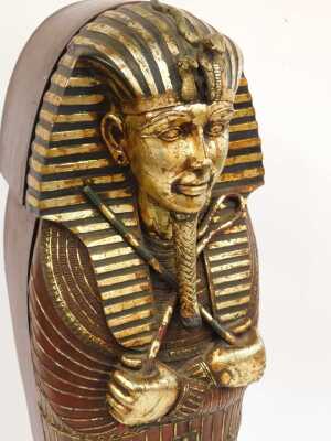 Three Egyptian related items, comprising a wooden pharaoh head, overpainted in gilt, 68cm high, 41cm wide, a sphinx style cat, 45cm high, and an Egyptian sarcophagus display case, 130cm high, 34cm wide, 28cm deep. - 4