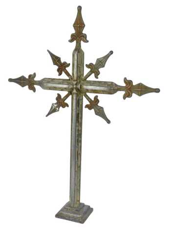 An early 20thC steel and wirework crucifix altar cross, heavily decorated on a stepped base, 70cm high.