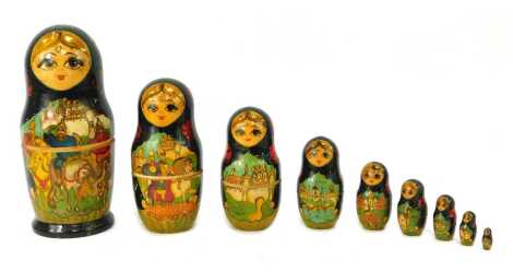 A Russian Matryoshka nesting doll, of nine graduated dolls, the largest doll decorated with a scene depicting warriors on horseback, signed to base, 22cm high.