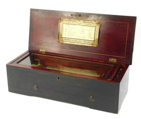 A 19thC Swiss rosewood cased music box, playing six airs, the case with line inlay and marquetry panel depicting a sword, artist pallet, etc, 42cm wide.