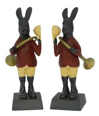 A pair of painted cast metal figures, each modelled as a hare with a musical instrument, 22cm high.