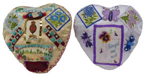 Two sweetheart embroidered pin cushions, one in purple with Forget Me Not embroidered decoration, 19cm wide, the other with To My Dear Father 1911-18, 20cm wide.