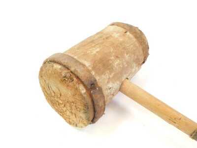 A large wooden and metal bound mallet, 79cm long. (AF) - 2