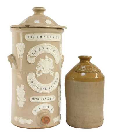 A 19thC Improved Cleansable Charcoal stoneware water filter, relief decorated with flowers, crest, etc., 44cm high, together with a TP Wood and Co Chesterfield stoneware flagon.