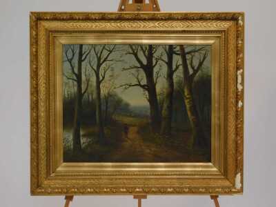 G Wyatt (late 19th/early 20thC School). Figure on a country path surrounded by trees beside a lake, oil on canvas, signed, 40cm x 49cm. - 2