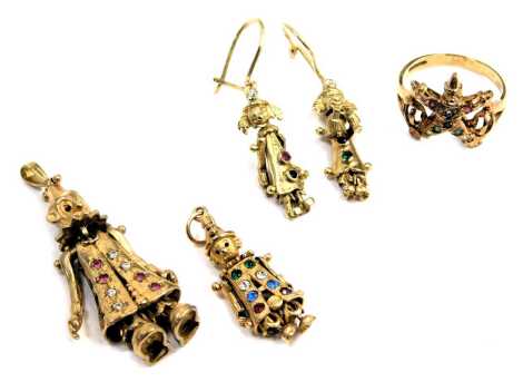 A suite of clown jewellery, comprising a pair of clown drop earrings, yellow metal unmarked, set with ruby and emerald, an articulated clown pendant, semi precious stone set, yellow metal, unmarked, a smaller example, and a clown dress ring, all yellow me