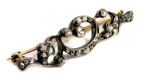 A Victorian diamond foliate scroll brooch, set in white and yellow metal, 3.3g.