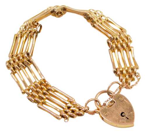 A gate bracelet, of five bar design with safety chain and heart shaped padlock clasp, yellow metal stamped 9ct, 20cm long, 17.5g.