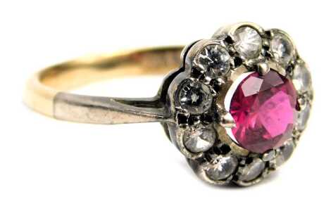 A paste stone set cluster ring, set with pink and white paste stones in floral cluster, in a silver setting, on a yellow metal band stamped 9ct silver, ring size P½, 2.9g all in.