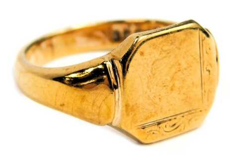 A 9ct gold signet ring, the rectangular ring panel with canted corners and floral scroll border, on a plain band, maker LW, Birmingham 1982, ring size Q½, 5.5g all in.