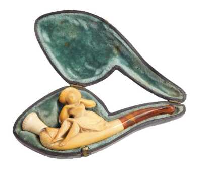 A late 19th/early 20thC meerschaum pipe, the carved meerschaum top depicting a figure perched on pipe with an amber cheroot, in a fitted case.