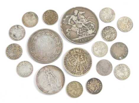 A group of pre decimal silver coinage, including a five shilling bank token dated 1811, a Queen Victoria crown dated 1893, two silver two shillings, and various threepence pieces, 2.70oz. (a quantity)