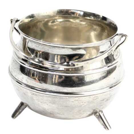 An Edward VII silver sugar basket, with twist swing handle, of cauldron form, maker SI Limited, London 1901, 4.35oz.