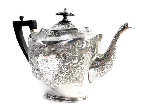 A Victorian silver plated teapot, with ebonised handle and knop, with embossed floral decoration and bearing inscription Presented to B Sowden 1895, maker L&W, stamped EP, 17cm high.