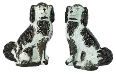 A pair of 19thC Staffordshire pottery Spaniels, each in brown and white colourway, 26cm high.