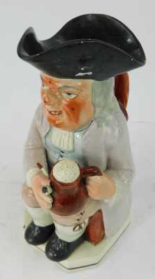 A 19thC pottery Toby jug, modelled as a seated gentleman wearing a tricorn hat holding a tankard of beer and pipe, 26cm high. - 2