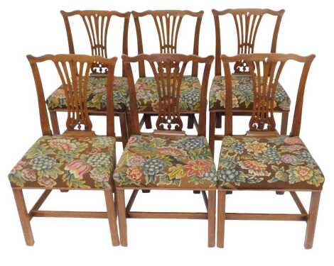 A set of six 19thC Chippendale style mahogany dining chairs, each with a shaped back with pierced splat floral upholstered overstuffed seat, on square chamfered legs.