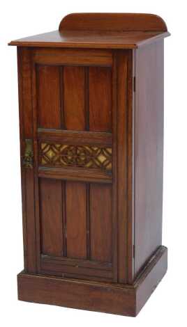 A Victorian walnut pot cupboard, the top with a raised back above a panelled door, enclosing shelf, on plinth base, 87cm high, 36cm wide, 36cm deep.