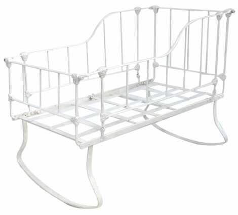 A Victorian white painted cast iron cot, 57cm wide, 104cm long.