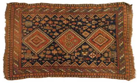 A Qashqui blue ground rug, with multiple central medallions and animal motifs, within multiple wide and narrow borders, 250cm x 145cm.