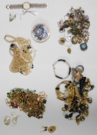 A group of assorted costume jewellery, comprising cultured pearl necklace with 9ct clasp, clip on earrings, bangles, faux pearl necklaces, crystal longuards, Swarovski crystal pendant and chain, Newbridge silver pendant and chain, Mappin and Webb wristwat