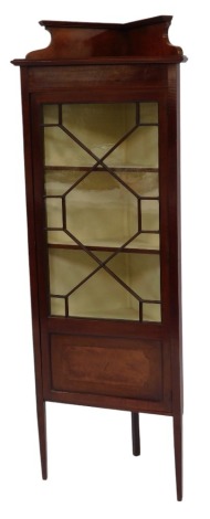 A Victorian mahogany corner display cabinet, the top with a raised back above an astragal glazed door enclosing three shelves, raised on square tapering legs, 165cm high, 59cm wide, 32cm deep.