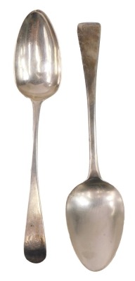 Two George III silver Old English pattern serving spoons, one bearing rubbed initials, makers Samuel Godbehere and Edward Wigan, London 1792 and another maker AH, London 1810, 3.67oz. (2)