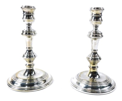 A pair of George V silver candlesticks, each on tapered stem with weighted base, maker MNW Limited, London 1978, 18cm high, 20.39oz gross.