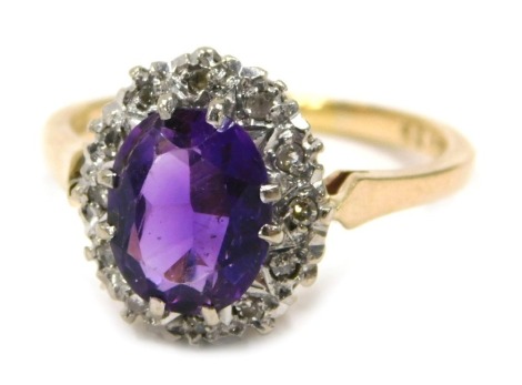 A 9ct gold amethyst and diamond dress ring, the oval amethyst in four double claw setting, surrounded by tiny diamonds in illusion white gold setting on raised shank, on yellow metal band, ring size N½, 3.2g all in.