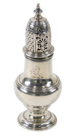 An 18thC silver sugar castor, the pierced top bearing ram crest, maker Samuel Wood, London, assay date letters indistinct possibly 1744, 5.34oz.