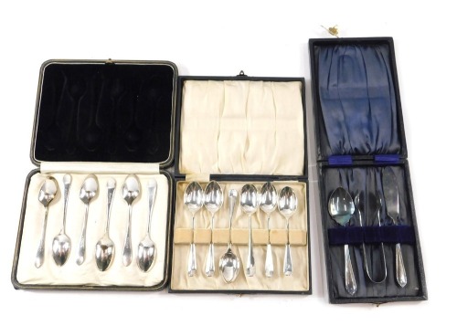 A cased set of six George V silver fiddle pattern teaspoons, each bearing the initial D, maker GGR, Sheffield 1919, 2.66oz, in fitted case, cased tongs, butter knife and preserve spoon, and a cased set of silver plated teaspoons. (3)