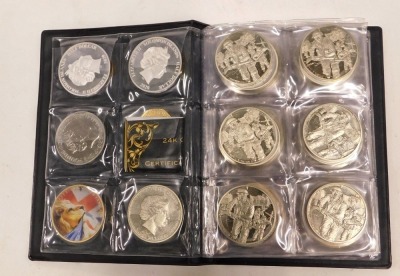 An album of five pound and other collectors coins, to include D-day anniversary, 50th anniversary of the fifty pence, V for Victory, Disney Winnie the Pooh, and others. (1 album) - 2