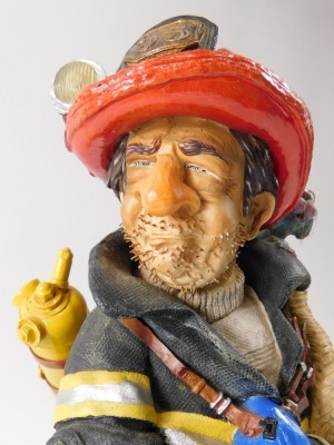 A model of a French fireman, label for The Comic Art of Guillermo Forchino, titled Le Sapeur-Pompier, limited edition number 01900, with some paperwork, 39cm high. - 2