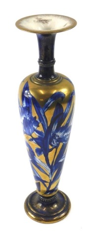 A T.F & S.L Pottery vase, in the manner of Royal Doulton, decorated with flowers and leaves, in deep blue, on a gold ground, printed marks to underside, 40cm high.