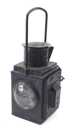 An ebonised tin paraffin lamp, possibly rail related, stamped BR(W), 46cm high.