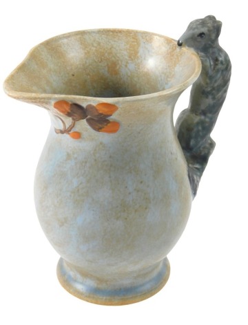 A Burleighware jug, with raised decoration of acorn and leaves, with a squirrel handle, 19cm high.