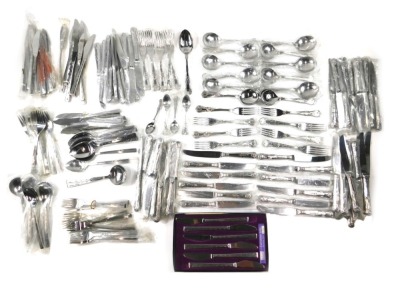 A quantity of unused stainless steel cutlery, stamped Executive Suite Korea, and other similar pieces. (2 trays)