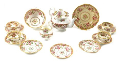 A 19thC Staffordshire porcelain part tea service, printed and painted with flowers in Chinese style. (AF)