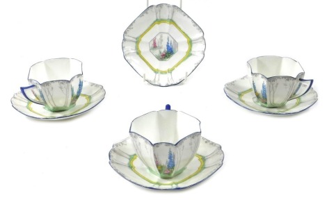 Three cups and four Shelley porcelain saucers, each decorated with garden flowers. (AF)