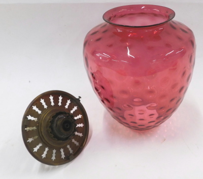 A late 19th/early 20thC dimpled cranberry tinted glass shade, with paraffin fittings stamped Vulcan, 40cm high. - 2