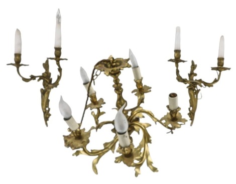 A cast brass five branch chandelier, decorated with foliate rococo scrolls, 40cm wide, (AF), and an associated pair of wall lights.